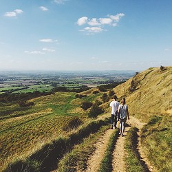 people walking along a rough track (image: Robert Bye on Unsplash)