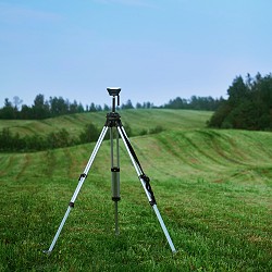 tall metal tripod set up on an area of cut grass