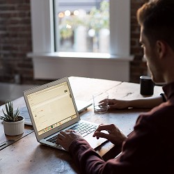 man working at a laptop (image: Bench Accounting on Unsplash)