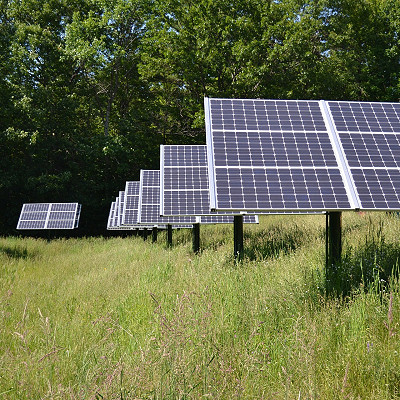 solar panels in a grassy field